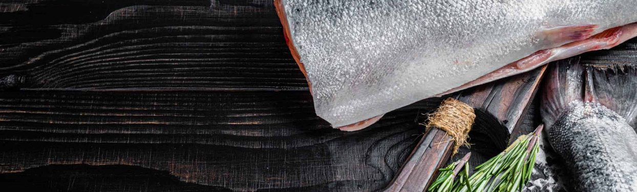 raw-cut-salmon-fish-on-a-wooden-cutting-board-with-2022-01-19-00-22-45-utc.jpg